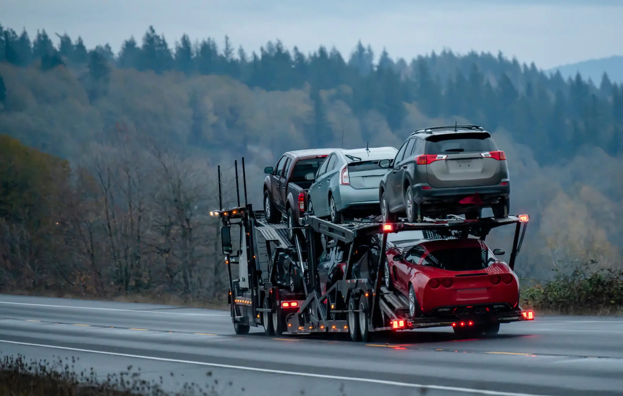 Car transportation by big rig semi truck