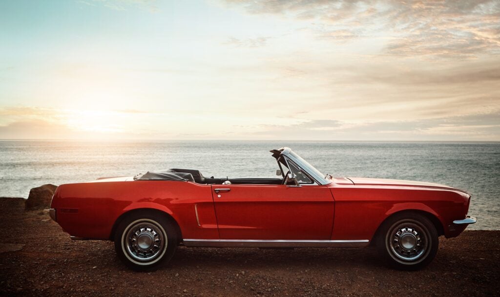 Convertible car sunset beach adventure