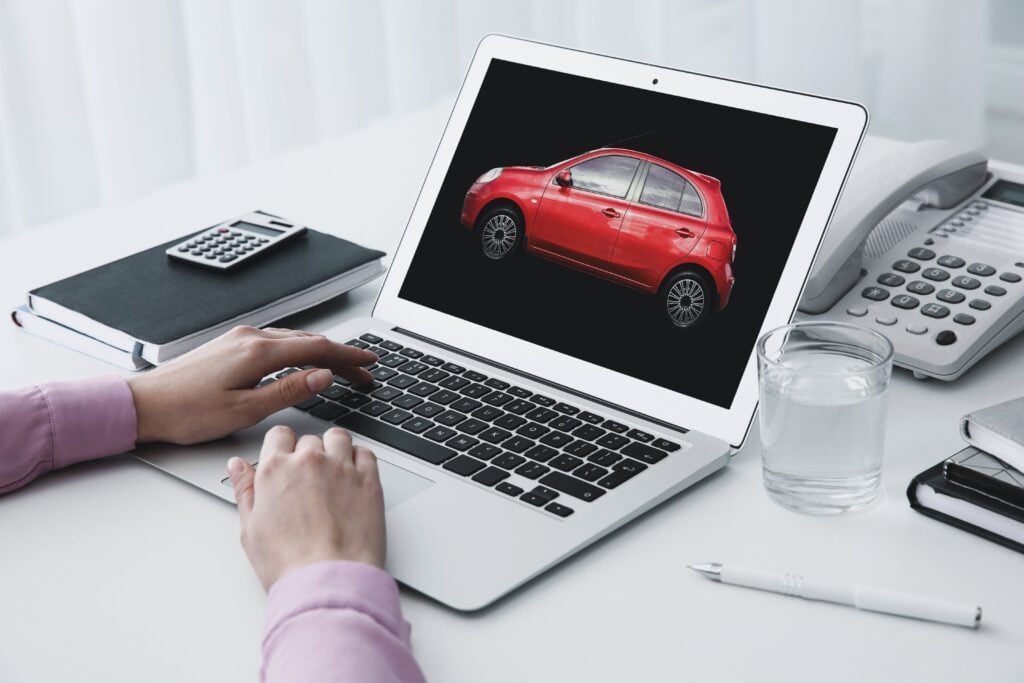 Woman choosing car using laptop